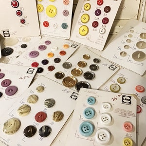 May include: Assortment of plastic buttons in various colors and sizes, displayed on white cards with numbers and labels. The cards are labeled "L.I.D.Z. Colors for Spring/Summer 1978".