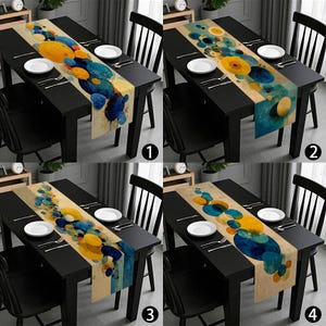 May include: A set of four images showcasing a black dining table with a decorative table runner. The runner features an abstract design of yellow and blue circular shapes on a beige background. White plates and silverware are set on the table.