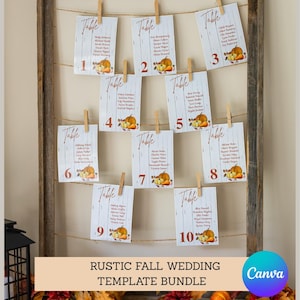 May include: A rustic wooden frame displays ten white cards with guest names, clipped to twine. Each card features a pumpkin illustration and the word "Table." The bottom banner reads "RUSTIC FALL WEDDING TEMPLATE BUNDLE" with a Canva logo.