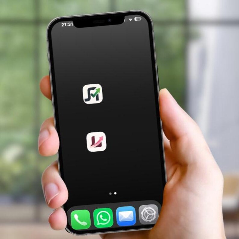 May include: A black smartphone held in a hand, showing a black screen with two app icons and a row of app icons at the bottom. The time 21:31 is displayed at the top left.