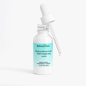 May include: A white bottle of ReKora Pure brightening serum with a dropper. The label is light blue and features the text "Polydeoxyribonucleotide (PDRN) brightening serum." The bottle contains 1 fl oz (30ml) of serum.