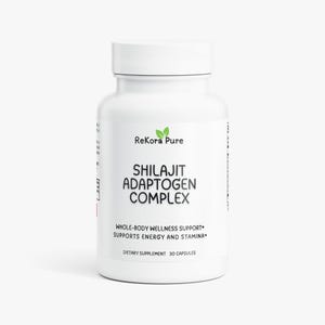 May include: A white bottle of ReKora Pure Shilajit Adaptogen Complex dietary supplement. The bottle has a white cap and contains 30 capsules. Text on the bottle reads "Whole-Body Wellness Support" and "Supports Energy and Stamina."