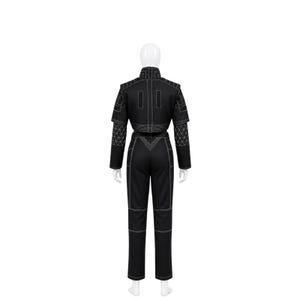 May include: Black jumpsuit with white stitching. The outfit features a cropped jacket with geometric patterns on the sleeves and shoulders, and matching trousers. The jumpsuit is displayed on a mannequin.