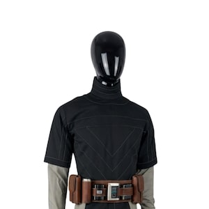 May include: Black costume with a high collar and short sleeves. The costume features a brown belt with pouches and a digital display. The outfit is displayed on a black mannequin head and a gray and white striped shirt.