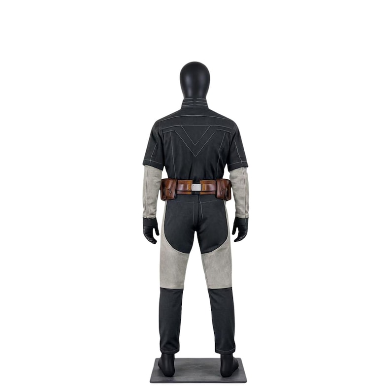May include: A black and gray costume displayed on a mannequin. The outfit includes a short-sleeved top, pants with gray panels, a brown belt with pouches, and gloves. The mannequin is on a gray base.