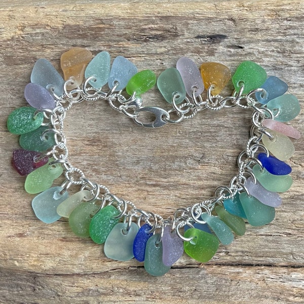 Sea glass jewelry- 34 pieces of Colorful sea glass on a 16ga sterling silver bracelet. All jump rings are welded.