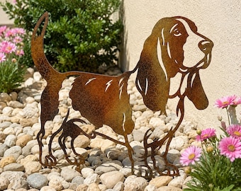 May include: A flat metal silhouette of a Basset Hound dog featuring a weathered, rusted brown finish with a visible crackled texture. The dog is depicted in a standing profile position with long ears, a raised tail, and detailed cutouts.