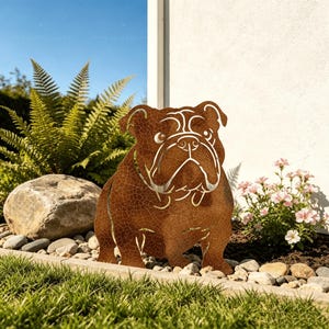 May include: A rust-coloured metal garden sculpture shaped like a bulldog with a textured, cracked finish. The cutout design features the distinct facial features and stocky build of a bulldog, standing upright as a decorative piece for outdoor spaces.