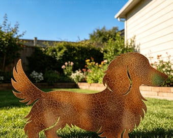 May include: A flat, silhouette-style garden ornament shaped like a long-haired dachshund dog. The metal surface features a textured, brown, crackled patina finish with a subtle green tint near the snout, standing upright in a grassy lawn.