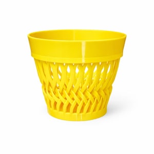 May include: A bright yellow wastebasket with a woven basket design. The wastebasket has a cylindrical shape with a wide rim and a decorative, open weave pattern around the sides. The basket is made of plastic.