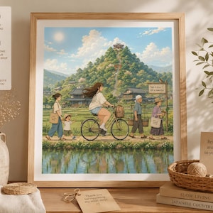 Può includere: Una stampa incorniciata raffigurante una serena scena della campagna giapponese. Una persona va in bicicletta, mentre altri camminano lungo un sentiero. L'opera d'arte presenta una montagna, case e acqua, sotto un cielo luminoso. Il testo "Take it slow, life is beautiful" è visibile.