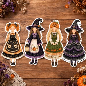 May include: Four die-cut stickers of characters in Halloween-themed outfits. One has orange pigtails, one wears a witch hat with a lantern, one has a pumpkin head, and one wears a black witch hat with spiderwebs, all featuring detailed dresses.