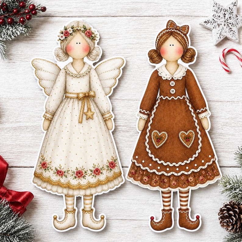 May include: Two flat decorative doll cutouts. The left doll is an angel in a cream dress with gold dots, a floral hem, and wings. The right doll wears a brown dress with white scalloped trim, heart-shaped pockets, and a matching brown hair bow.