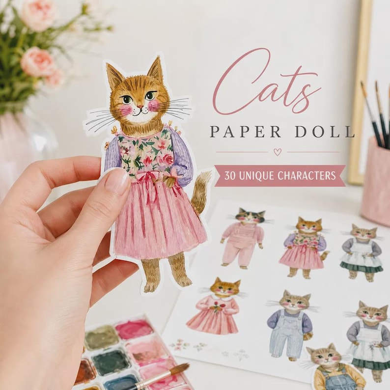 K&ouml;nnte beinhalten: Ein Papierpuppen-Set mit Illustrationen von Katzen in verschiedenen Outfits. Der Hauptausschnitt zeigt eine orangefarbene getigerte Katze mit einem Blumenoberteil und einem rosa Rock. Der Text lautet Cats PAPER DOLL und 30 UNIQUE CHARACTERS.