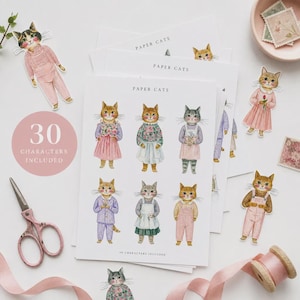 K&ouml;nnte beinhalten: Ein Set aus Papierpuppen mit illustrierten Katzen in verschiedenen Outfits. Die B&ouml;gen sind mit PAPER CATS und 30 CHARACTERS INCLUDED beschriftet. Die Katzen sind im Aquarellstil dargestellt und tragen Kleider, Latzhosen und Schlafanz&uuml;ge in Rosa, Lila und Gr&uuml;n.