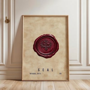 May include: Framed art print featuring a burgundy wax seal design with a floral emblem at the center. The word "SEAL" is printed in navy blue below the seal, with "MINIMAL ARTS" and the number "135" beneath it. The print has a beige background.