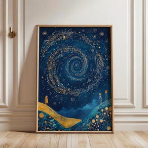 May include: Framed art print featuring a celestial design. A swirling galaxy of gold and white details against a deep blue background. Figures stand on a golden hill, gazing at the spiral. The artwork is in a wooden frame.
