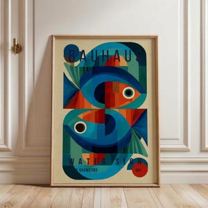 May include: Framed art print featuring a geometric design of two fish in shades of blue, orange, and green. The artwork includes the text "BAUHAUS" and "WATER SIGN" with "GEOMETRY" and the number "041". The print is in a wooden frame.