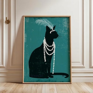 May include: A framed wall art print featuring a black cat silhouette against a teal background. The cat wears a white feather headpiece and multiple strands of white pearls. The text THE BLACK CAT and the number 186 are printed at the bottom.