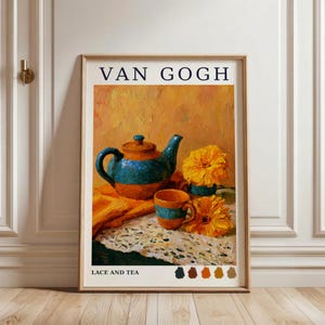 May include: A framed art print titled VAN GOGH LACE AND TEA featuring an oil painting of a blue and orange teapot, a matching cup, and two yellow flowers on a lace cloth. The background is a textured golden yellow, with color swatches below.