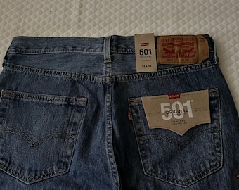 men's Levis Jeans 501 button fly 23W 32L with tags
