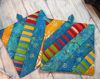 Pair of Rainbow Batik potholders, 8” homemade quilted