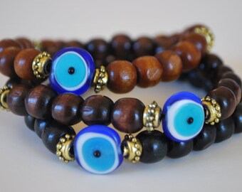 KABBALAH   Evil eye wood streachy bracelet .protection bracelet
