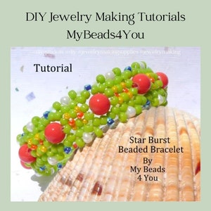 May include: A handmade beaded bracelet with a starburst design. The bracelet features green, red, white, and blue beads. The bracelet is displayed on a seashell. Text on the image reads "DIY Jewelry Making Tutorials" and "Star Burst Beaded Bracelet".