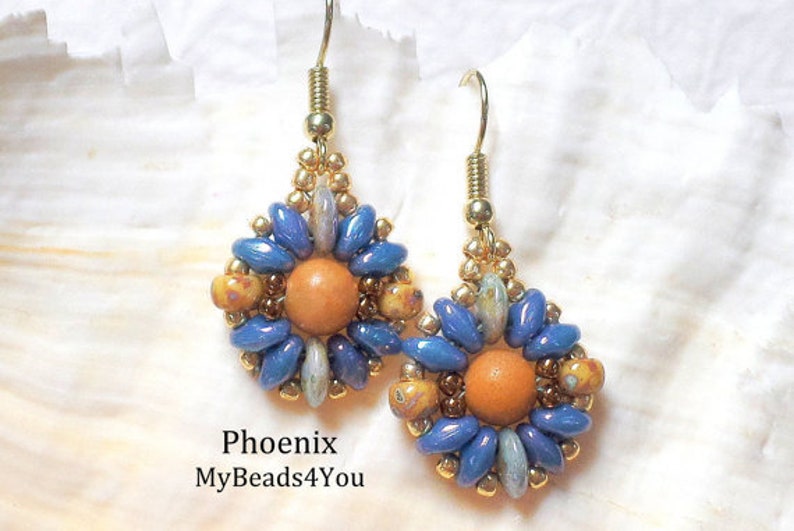 May include: A pair of beaded earrings featuring a central orange bead surrounded by blue and mottled yellow petal-shaped beads, accented with gold-tone seed beads and gold-tone metal hooks. The text Phoenix MyBeads4You is visible below.