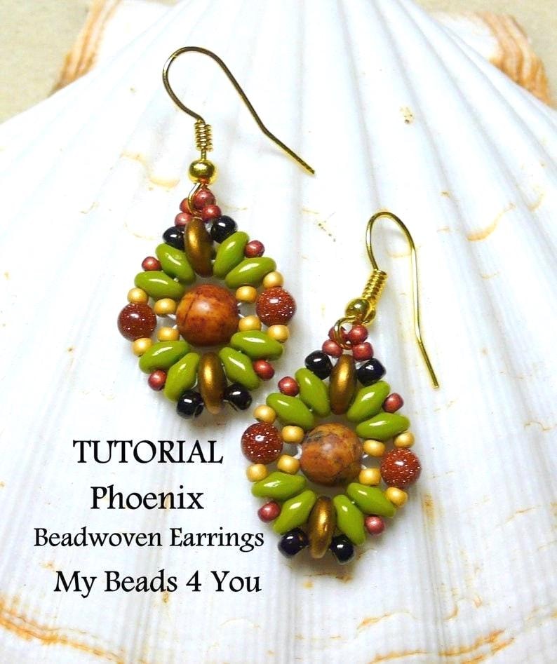 May include: A pair of beadwoven earrings featuring a central brown stone bead surrounded by olive green, metallic gold, black, and glittery copper beads. The earrings hang from gold-tone hooks. Text reads: TUTORIAL Phoenix Beadwoven Earrings My Beads 4 You.