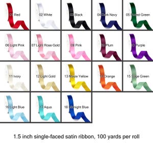 May include: A grid of satin ribbon rolls in various colors, including red, white, black, and navy. Each roll is labeled with a number and color name. The text at the bottom reads: 1.5 inch single-faced satin ribbon, 100 yards per roll.
