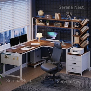 May include: L-shaped wooden desk with a white metal frame, two computer monitors, and a black office chair. The desk has a built-in shelf with books, a lamp, and decorative items. A printer and storage drawers are also visible.