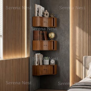 Corner Shelves Floating Wall Cabinet Set of 3, Fluted Corner Shelf with Sliding Doors and Walnut Finish | Floating Corner Shelf for Living Room Bedroom and Office | Space Saving Wall Storage

Empty corners are some of the most overlooked storage opportunities in any home. These corner shelves by Serena Nest turn every unused wall angle into a stylish, functional display space that works just as hard as it looks good.