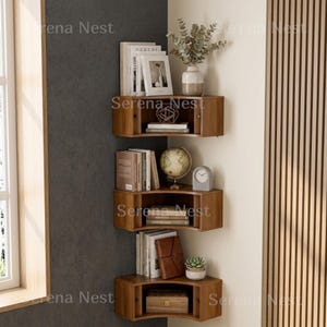 Corner Shelves Floating Wall Cabinet Set of 3, Fluted Corner Shelf with Sliding Doors and Walnut Finish | Floating Corner Shelf for Living Room Bedroom and Office | Space Saving Wall Storage

Empty corners are some of the most overlooked storage opportunities in any home. These corner shelves by Serena Nest turn every unused wall angle into a stylish, functional display space that works just as hard as it looks good.