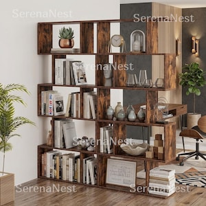 May include: A multi-tiered, rustic brown wood bookshelf with an open-back design. The shelves are filled with various books, a potted succulent, a clock, glass vases, decorative sculptures, and a framed architectural drawing on the bottom shelf.