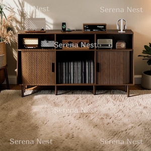 May include: A dark brown wooden media console featuring two side cabinets with vertical fluted doors, an open center shelf holding vinyl records, and an upper shelf displaying audio equipment, including a turntable, speakers, and headphones.