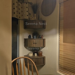 Corner Shelves Floating Wall Cabinet Set of 3, Fluted Corner Shelf with Sliding Doors and Walnut Finish | Floating Corner Shelf for Living Room Bedroom and Office | Space Saving Wall Storage

Empty corners are some of the most overlooked storage opportunities in any home. These corner shelves by Serena Nest turn every unused wall angle into a stylish, functional display space that works just as hard as it looks good.