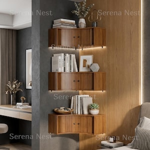 Corner Shelves Floating Wall Cabinet Set of 3, Fluted Corner Shelf with Sliding Doors and Walnut Finish | Floating Corner Shelf for Living Room Bedroom and Office | Space Saving Wall Storage

Empty corners are some of the most overlooked storage opportunities in any home. These corner shelves by Serena Nest turn every unused wall angle into a stylish, functional display space that works just as hard as it looks good.