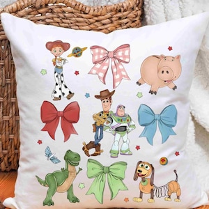 May include: A white square throw pillow featuring a colorful print of Toy Story characters including Jessie, Woody, Buzz Lightyear, Hamm, Rex, and Slinky Dog, interspersed with various solid-colored bows and a pink gingham bow pattern.