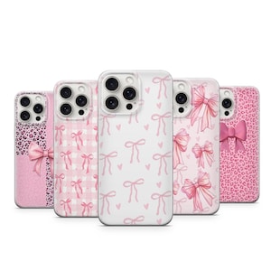 May include: Five phone cases with pink designs. The cases feature patterns of bows, hearts, gingham, and leopard print. Each case has a unique design, providing a range of styles.