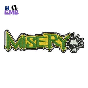 May include: Embroidered patch featuring the word "MISERY" in green and yellow, with a skull and spike design on the right. The patch has a black border and the text "HO of EMB" in the upper left corner.