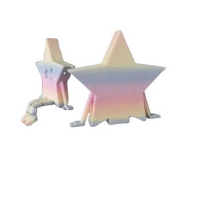 May include: Two star-shaped sculptures with pastel rainbow gradients. One star has a tail and small feet, the other has legs. The sculptures are in shades of pink, yellow, blue, and white.