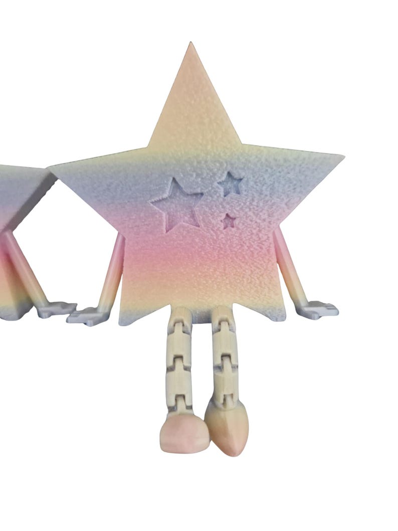 May include: A whimsical star-shaped figurine with a pastel rainbow gradient. The star has arms, hands, and segmented legs. Three smaller stars are carved into the front. The figurine is a unique decorative item.