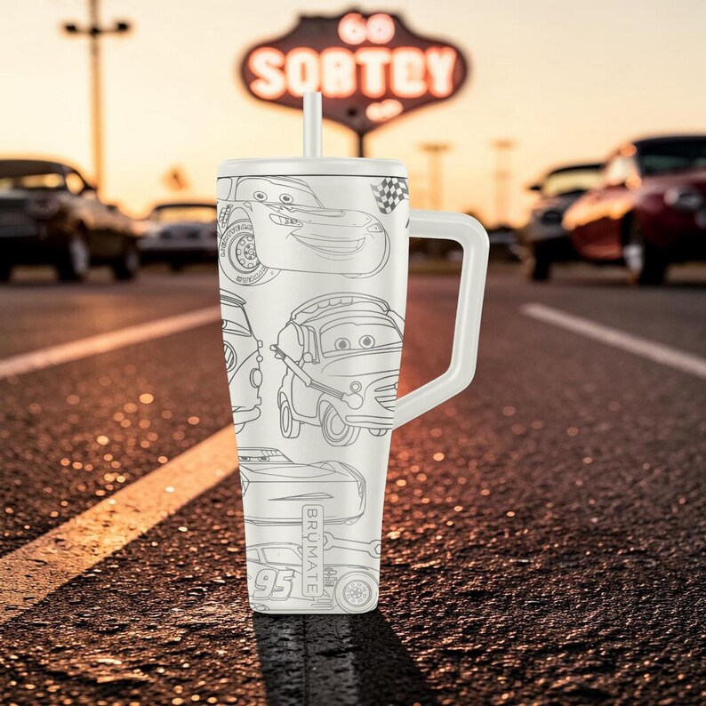 May include: A white stainless steel tumbler with a handle and straw, featuring a black line art pattern of various race cars and the number 95. The word BRUMATE is vertically printed on the side of the tumbler, which is set against a blurred road.