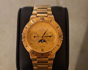 Orologio vintage Elgin FH-003 con calendario e fasi lunari al quarzo.
