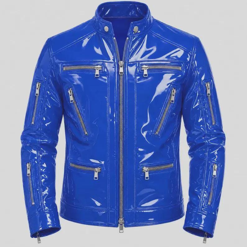 May include: A bright blue jacket with a glossy, patent-like finish. The jacket features a stand-up collar with two silver snap buttons, a full-length central zipper, and multiple zippered pockets on the chest and sleeves with silver hardware.