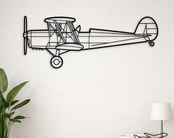 May include: A black metal wall art piece shaped like a vintage biplane. The design features a side profile of the aircraft with a prominent propeller, two stacked wings connected by vertical struts, a landing gear wheel, and a tail section.