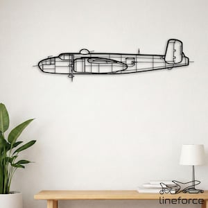May include: Black metal wall art depicting a detailed outline of a vintage airplane. The artwork features the plane's fuselage, wings, and propeller, mounted on a white wall. The design includes the text "lineforce" at the bottom.