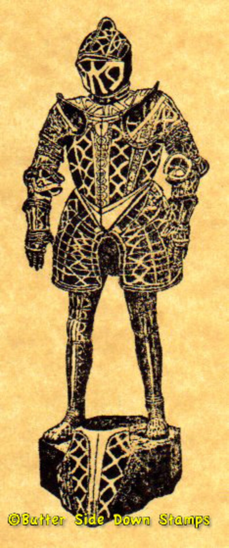 Puede incluir: Una ilustraci&oacute;n en blanco y negro de un caballero con armadura completa. El caballero est&aacute; de pie sobre una base con un patr&oacute;n similar a la armadura. La imagen est&aacute; sobre un fondo amarillo. El texto "Butter Side Down Stamps" est&aacute; en la parte inferior de la imagen.