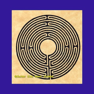 May include: A black and white circular labyrinth design on a beige background. The design is a single circle with multiple concentric circles and paths leading to the centre. The text "Butter Side Down Stamps" is at the bottom of the image.